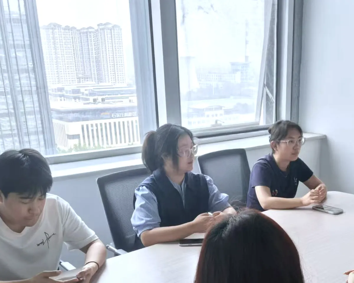Colleagues working through requirements together in a meeting room.
