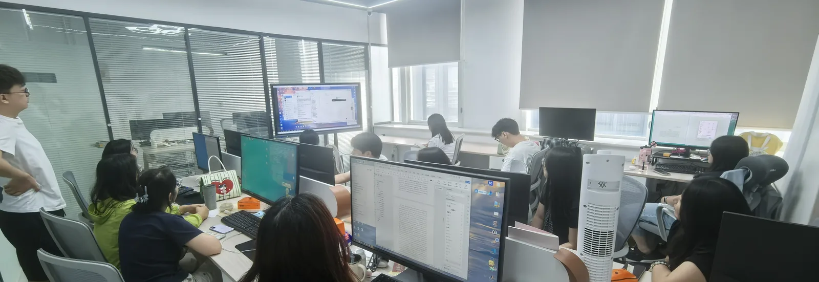 The delivery team at work across the shared office floor.